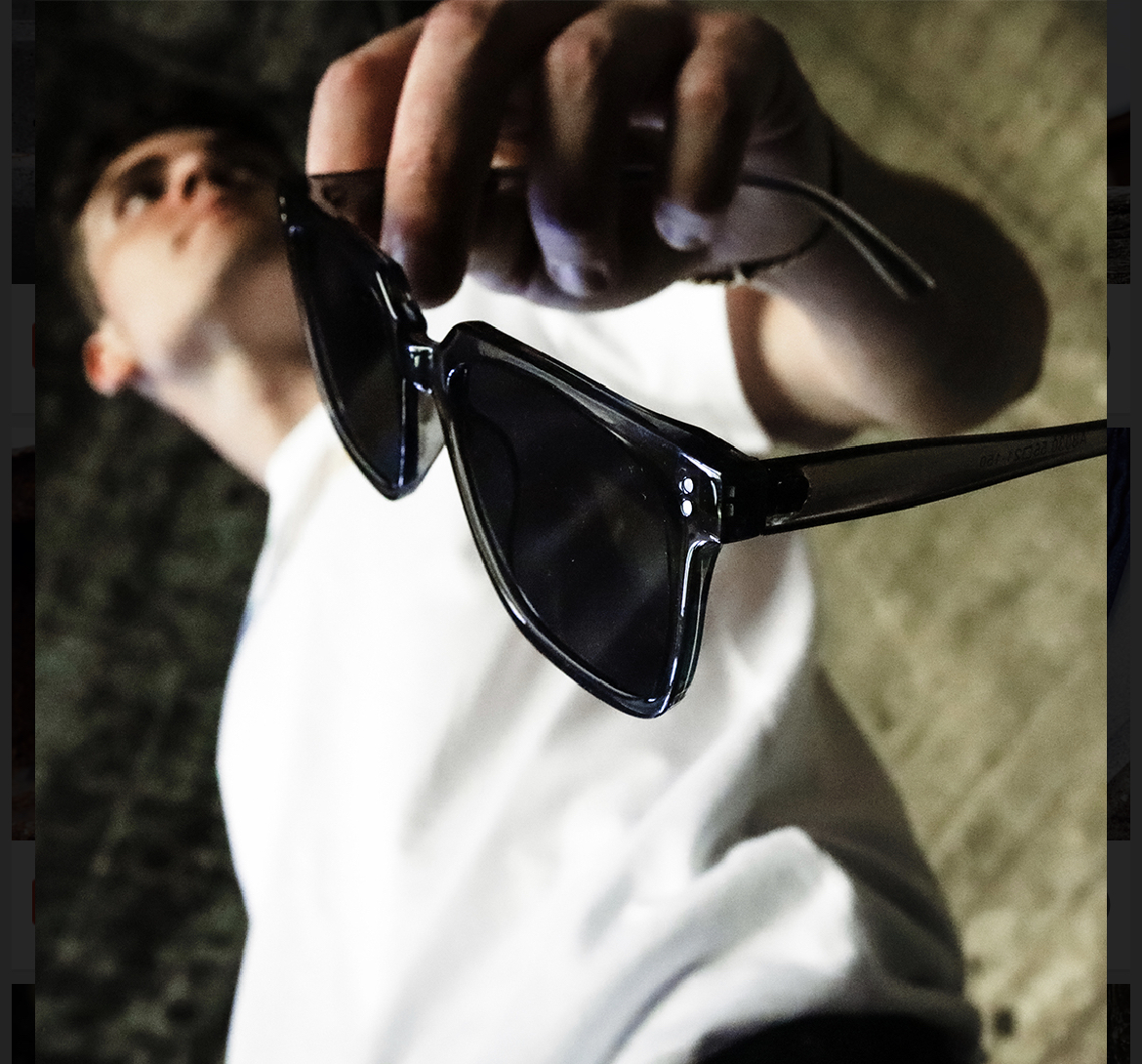 man holding specs man holding specs